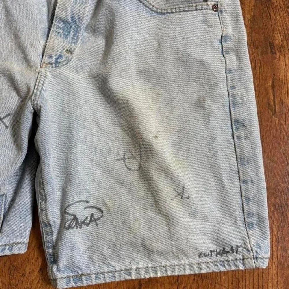 Lee blue denim shorts with paint marks and‎ writing, ultra faded